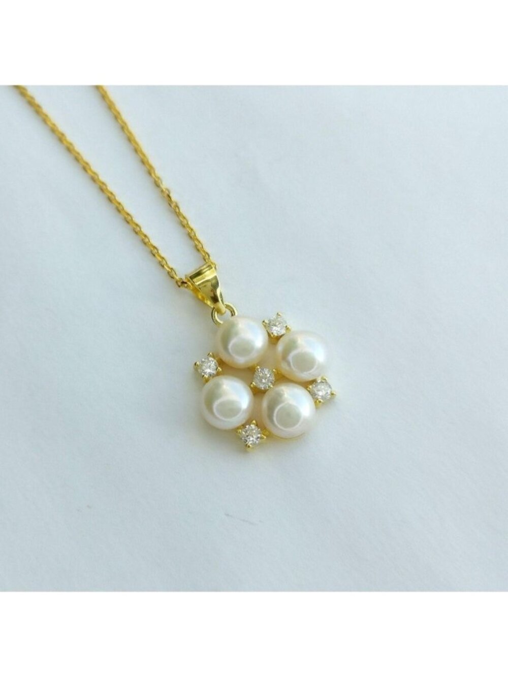 White cultured pearl pendant necklace with white Sapphire in 14k gold